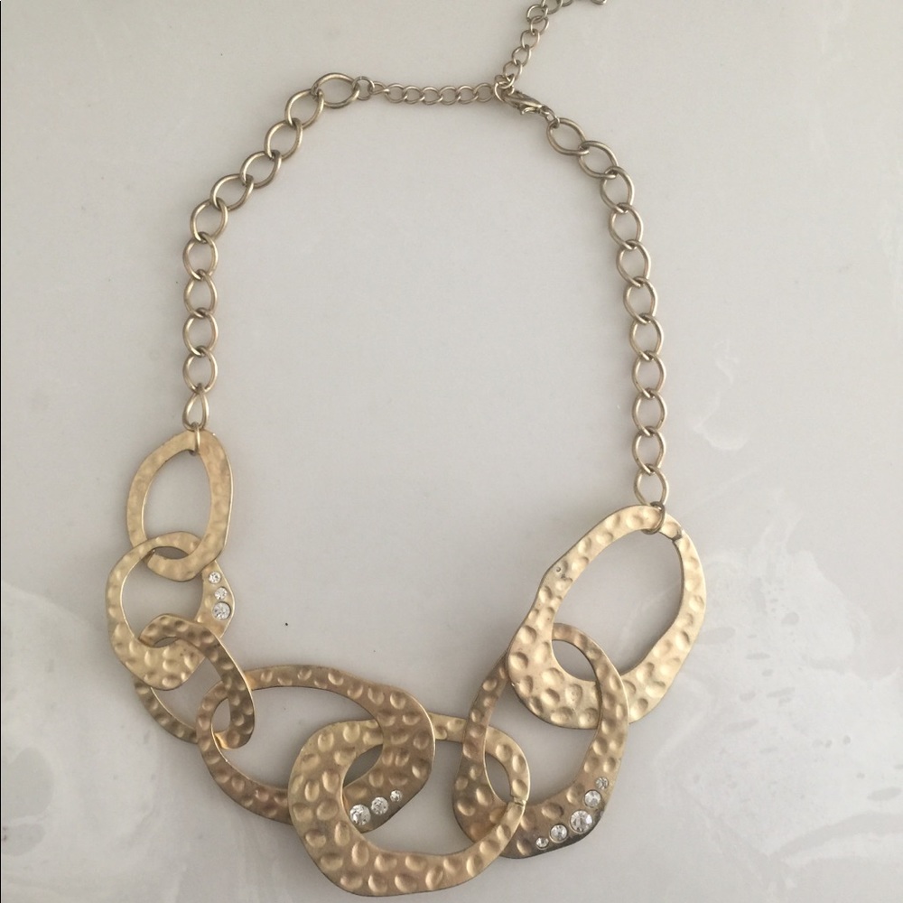 Gold tone hammered statement necklace with jewels